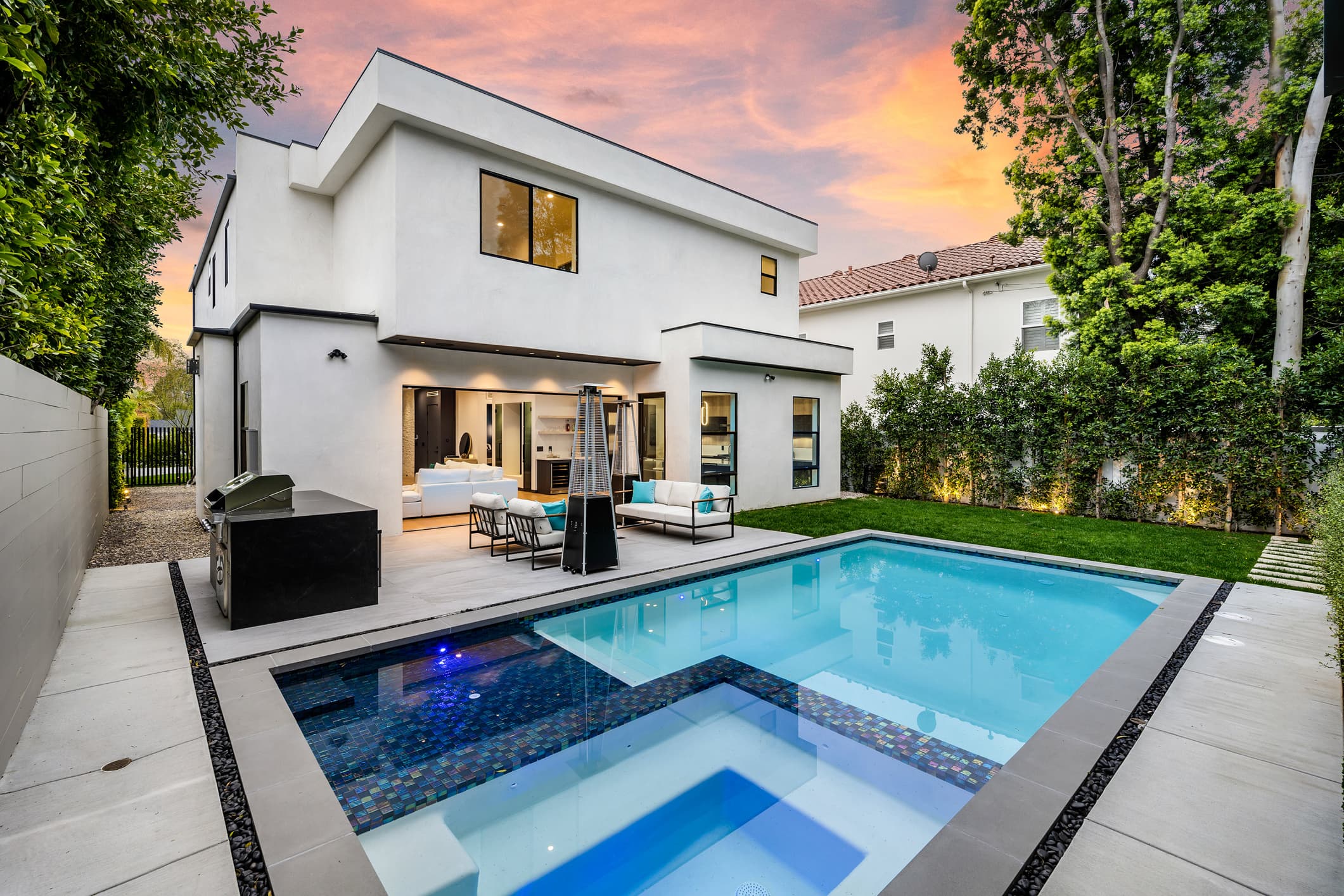 Noncombustible gravel and paver buffer in the first five feet around a luxury San Diego home, built for Zone 0 defensible space by Modern Yardz