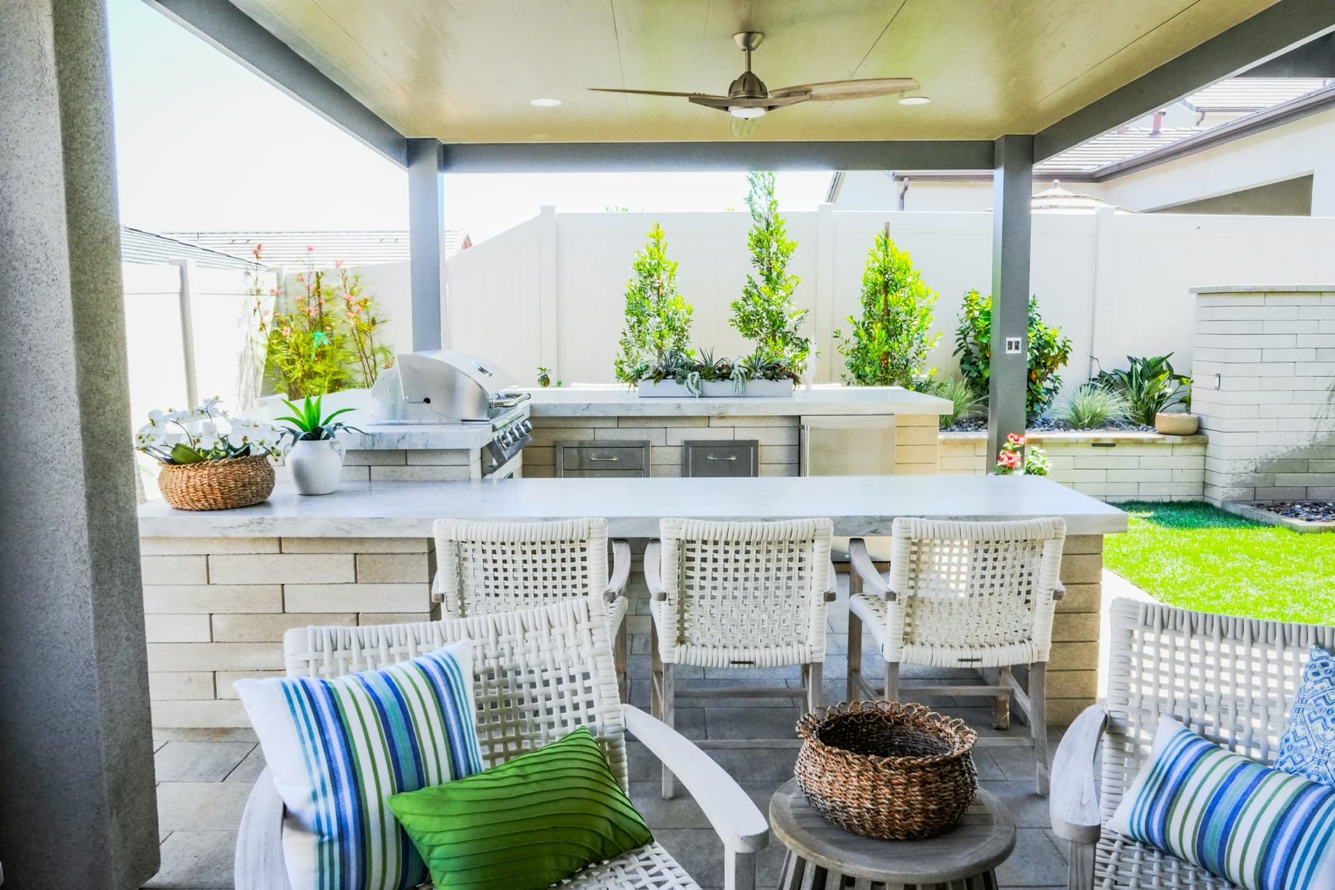Blue-tile pool with sheer-descent water features, designed and built by Modern Yardz in Encinitas, San Diego County